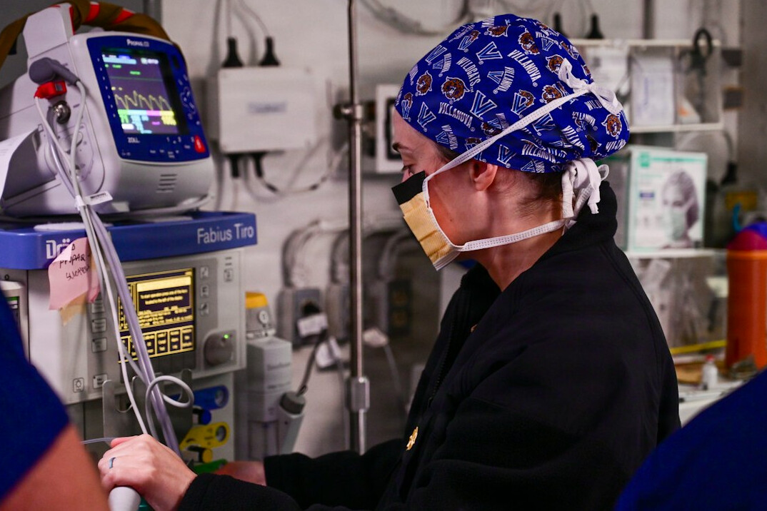 nurse helping patient in hospital