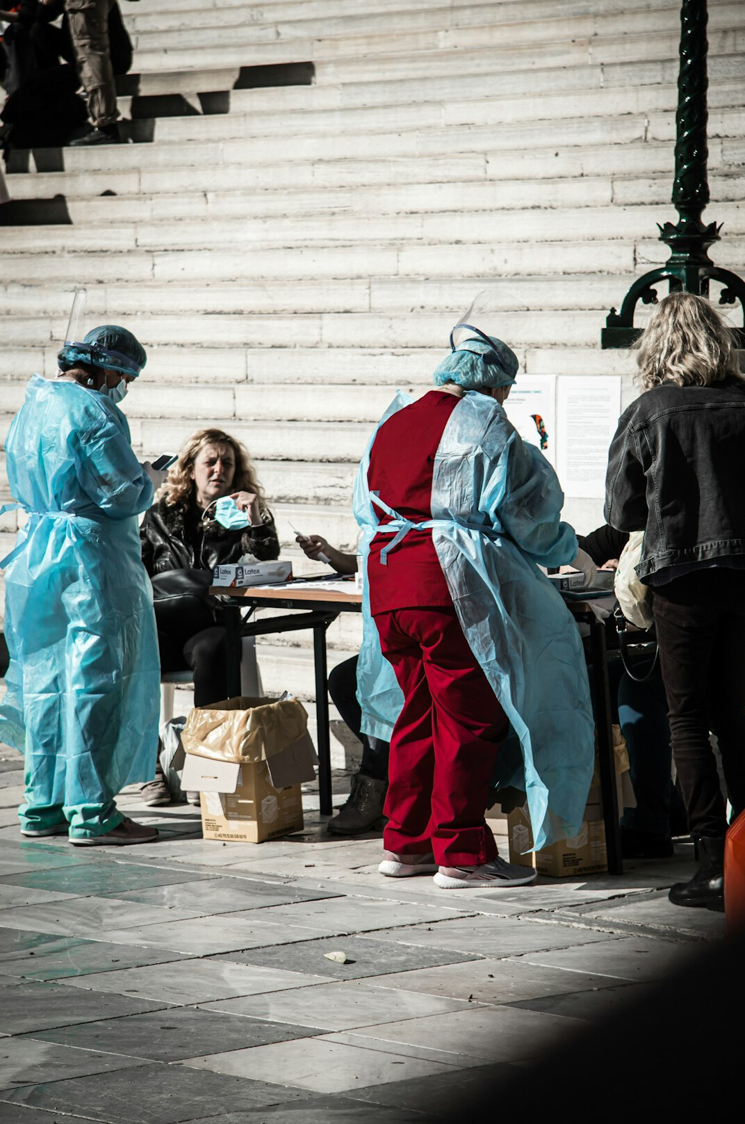 Group of healthcare workers in a practical workshop around a table